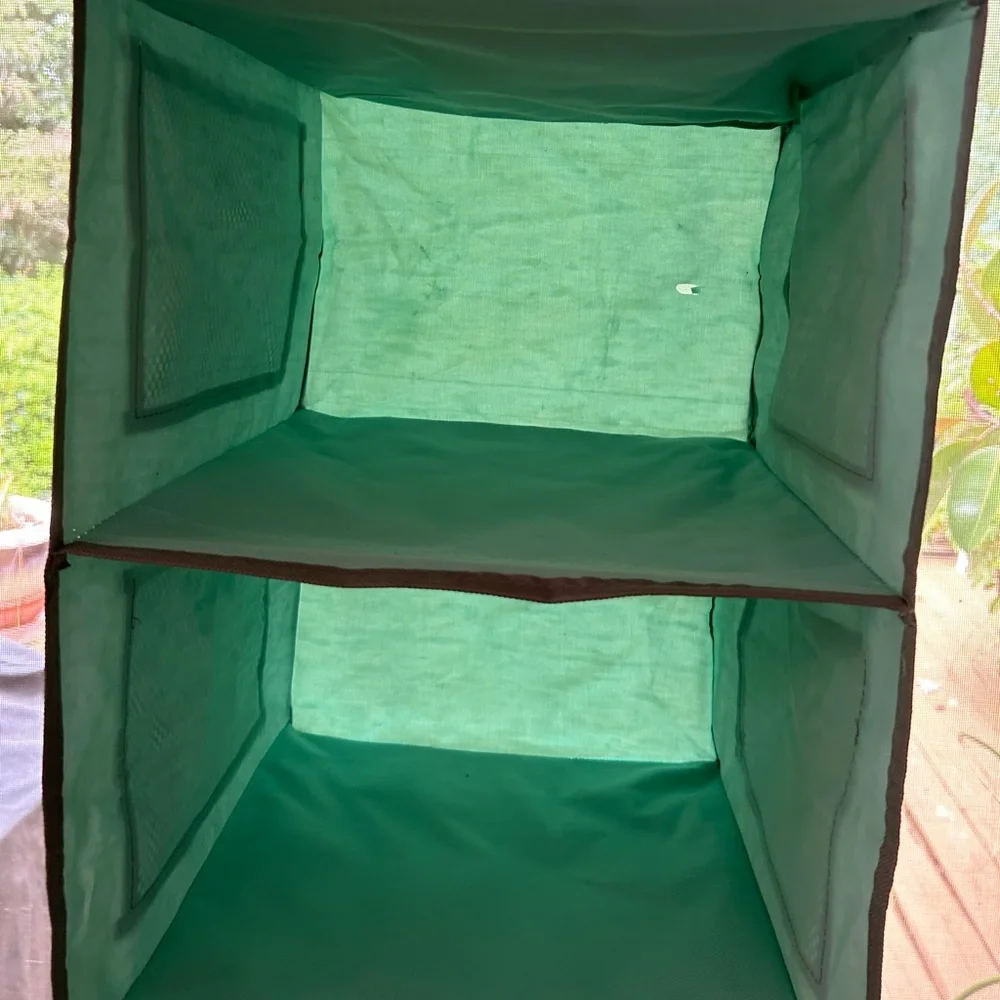 Aqua 6 shelf Storage Organizer. Hangs on closet rod. 12 mesh pockets on outside.